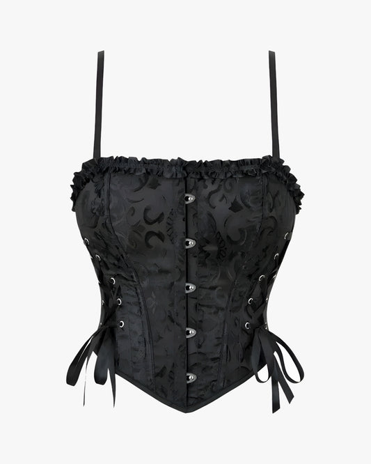 Corset bretelle noir sur fond studio gris clair