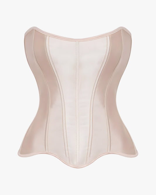 Corset nude sur fond studio gris clair
