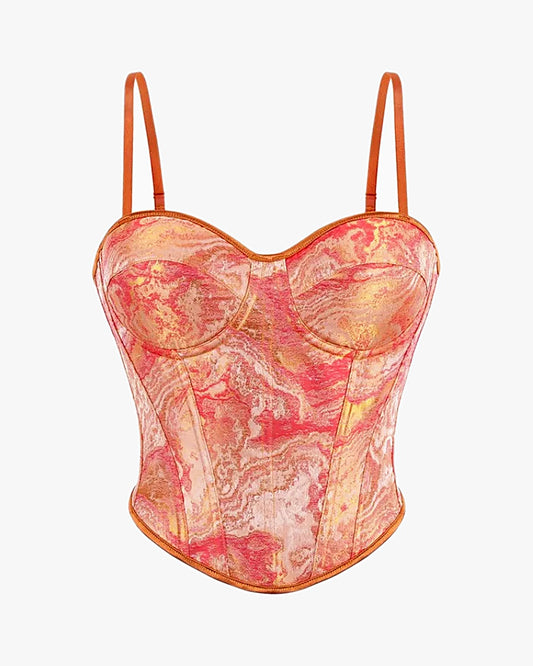 Corset orange sur fond studio gris clair
