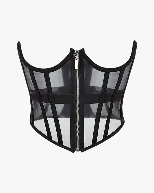 Corset seins nus sur fond studio gris clair