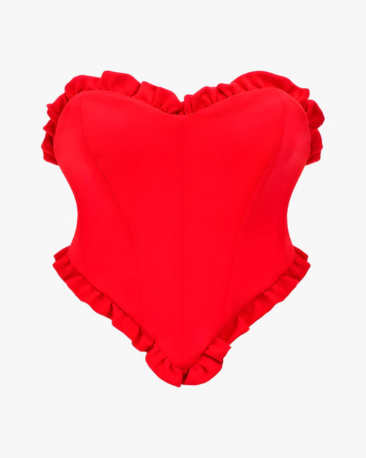 Corset sexy sur fond studio gris clair