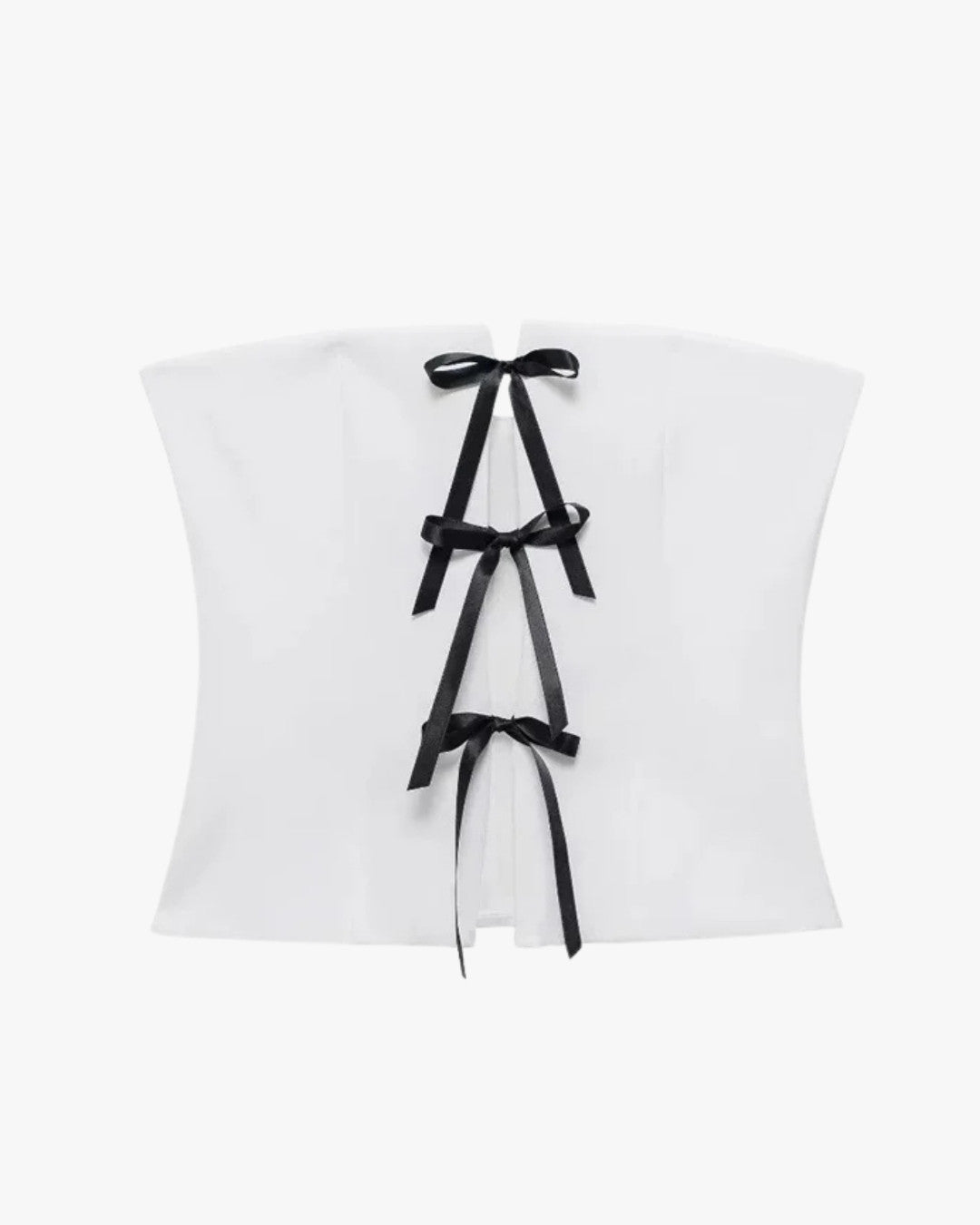 Haut style corset blanc sur fond studio gris clair
