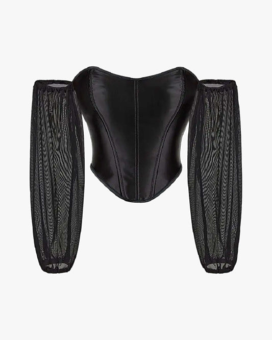 Top corset manche longue sur fond studio gris clair